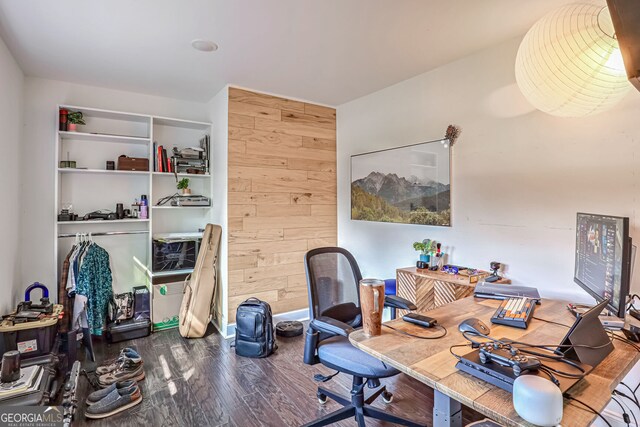 office space featuring wooden walls and dark hardwood / wood-style flooring