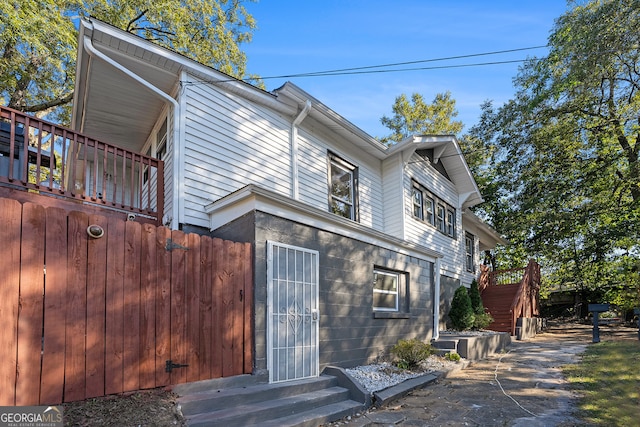 view of side of property with a deck