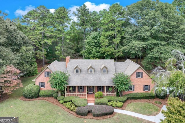 view of front of home with a front lawn and covered porch