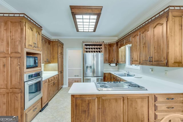 kitchen featuring ornamental molding, sink, and stainless steel appliances