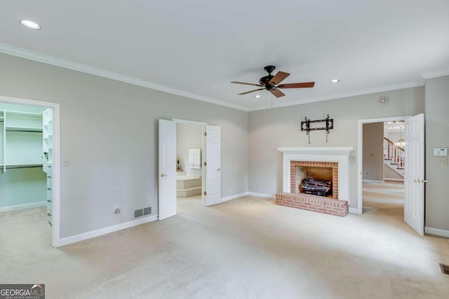 unfurnished living room featuring light carpet, a brick fireplace, ornamental molding, and ceiling fan