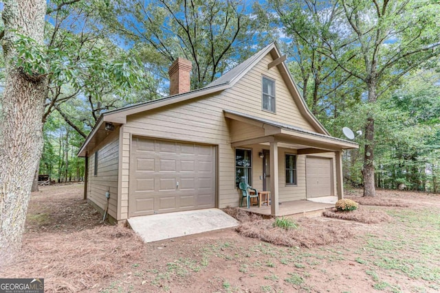 view of front of home featuring a garage and covered porch