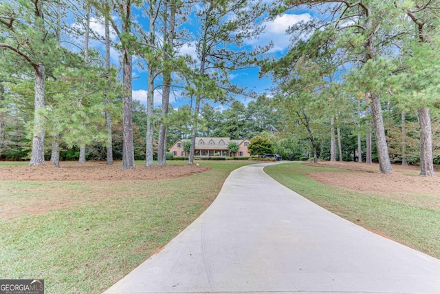 surrounding community featuring a lawn