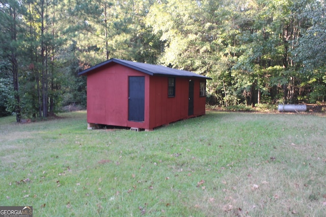 view of outdoor structure with a yard