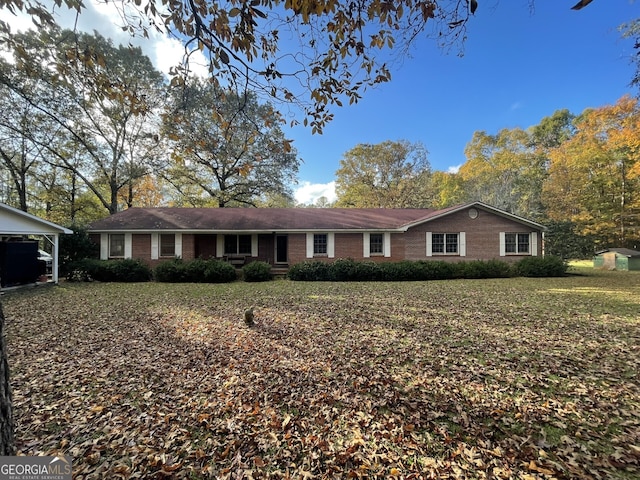 ranch-style house with a carport