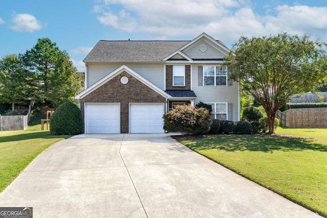 view of property with a garage and a front lawn