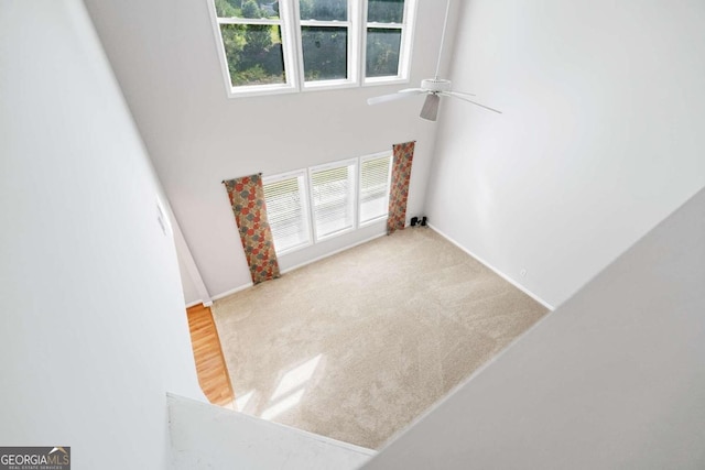 interior space featuring plenty of natural light and ceiling fan