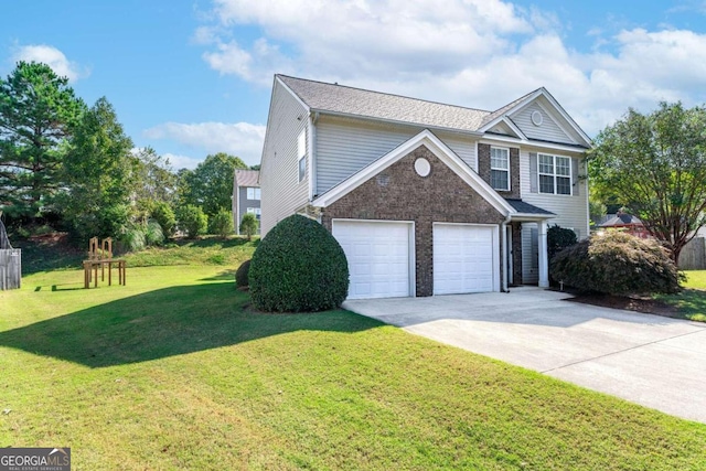 view of front of home featuring a front yard and a garage