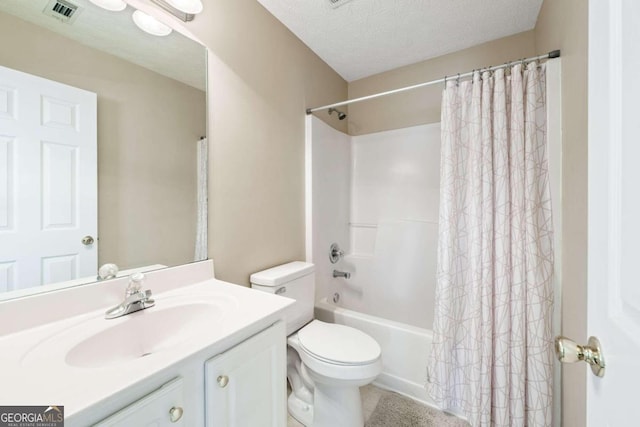 full bathroom featuring vanity, toilet, a textured ceiling, and shower / tub combo with curtain