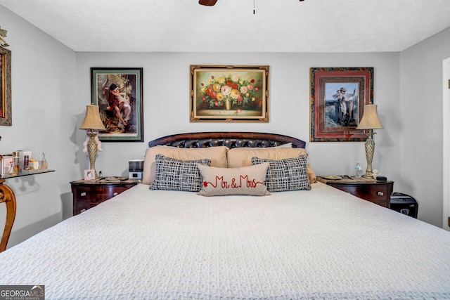 bedroom featuring a textured ceiling and ceiling fan