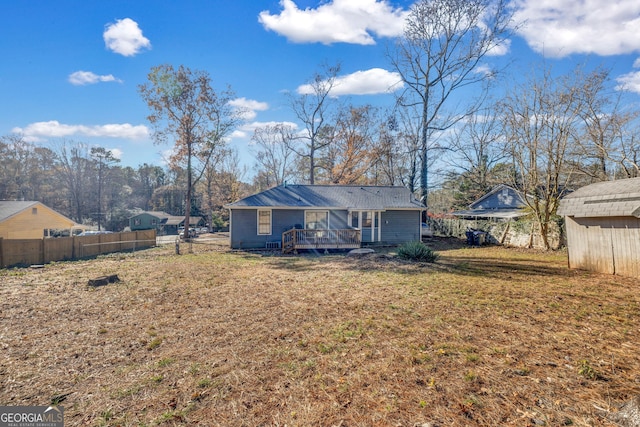 back of house with a yard