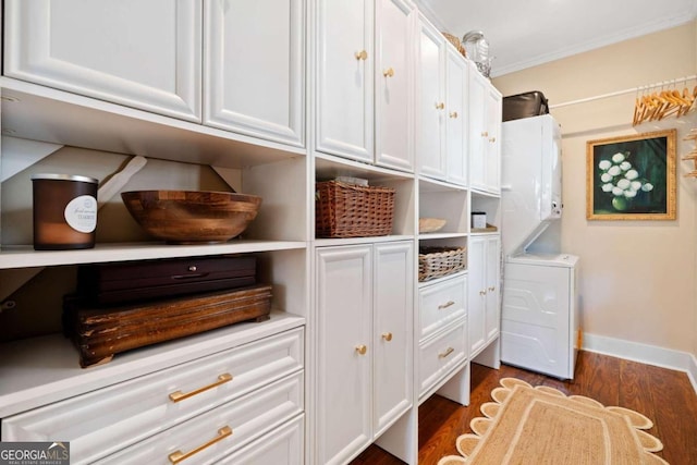 pantry with stacked washing maching and dryer