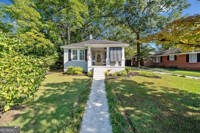 bungalow-style house with a front yard