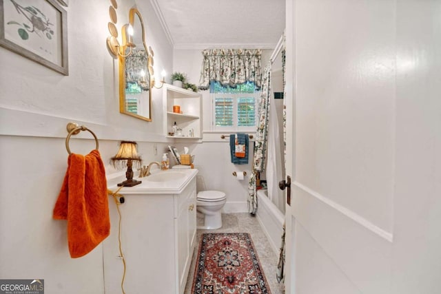 full bathroom with vanity, toilet, shower / bath combo, crown molding, and tile patterned flooring