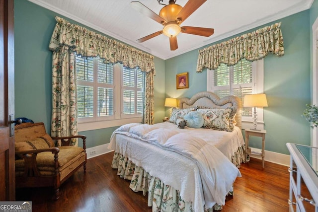 bedroom with ceiling fan, crown molding, and multiple windows