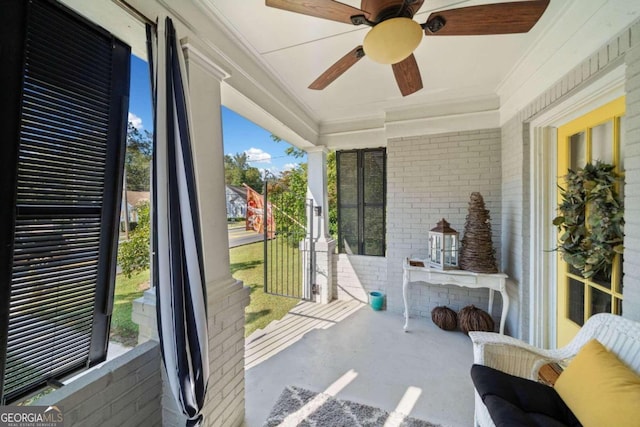 sunroom / solarium featuring ceiling fan