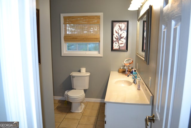 bathroom featuring vanity, toilet, and tile patterned floors