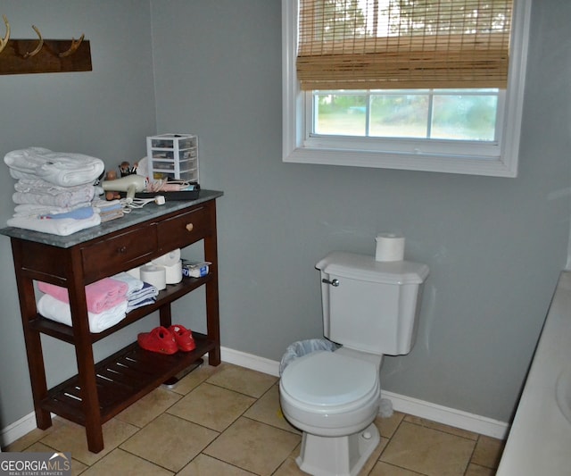 bathroom featuring tile patterned flooring and toilet