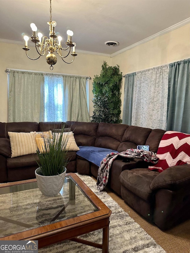 living room with an inviting chandelier and crown molding