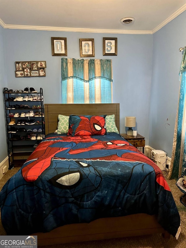 bedroom with carpet floors and crown molding