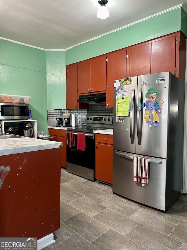 kitchen featuring stainless steel appliances, backsplash, and ornamental molding