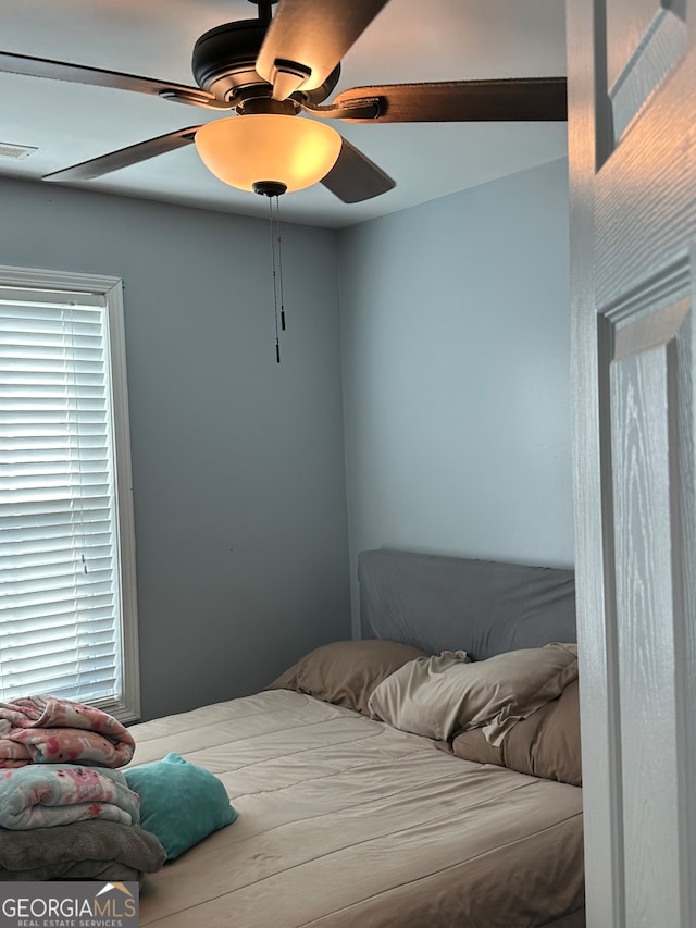 bedroom featuring ceiling fan