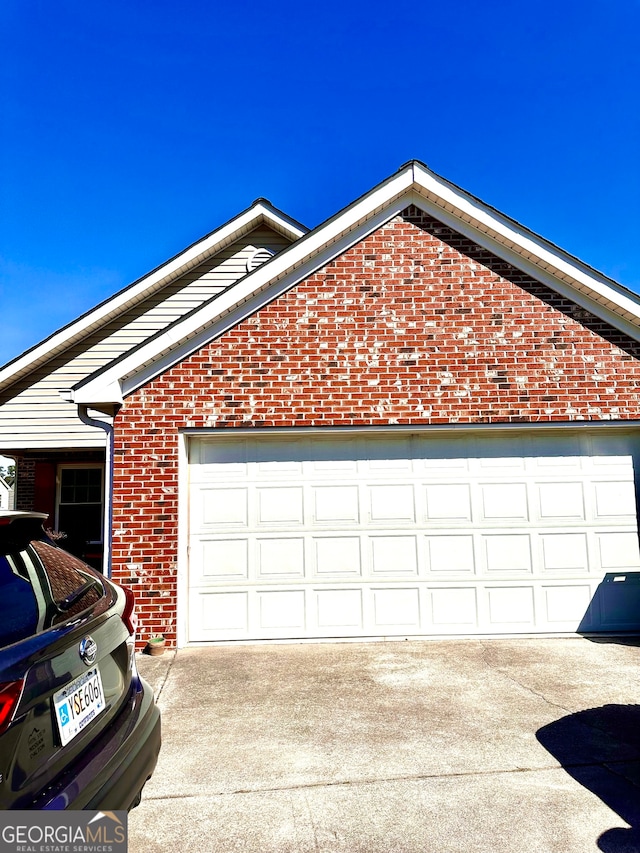 view of property exterior with a garage