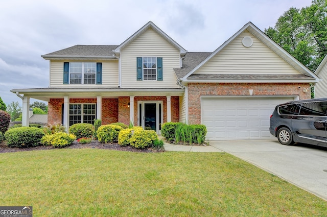 front of property with covered porch, a garage, and a front yard