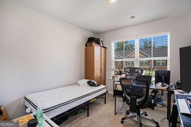 bedroom with light colored carpet