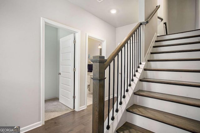 stairway with wood-type flooring