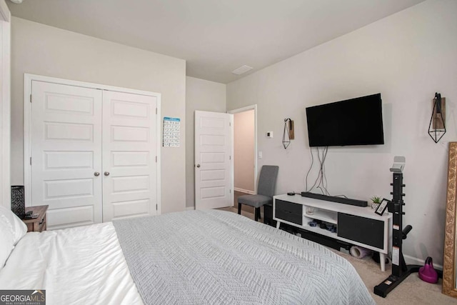 carpeted bedroom with a closet