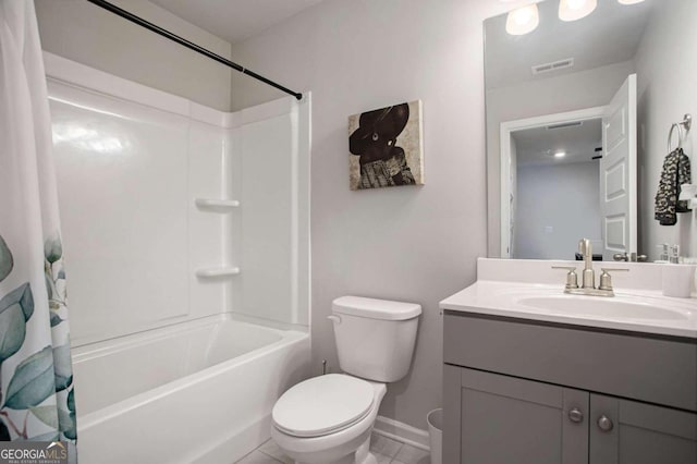 full bathroom featuring tile patterned floors, vanity, shower / tub combo, and toilet