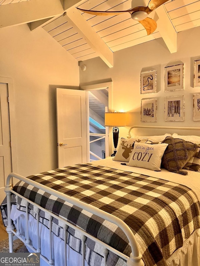 bedroom with vaulted ceiling with beams and wood ceiling