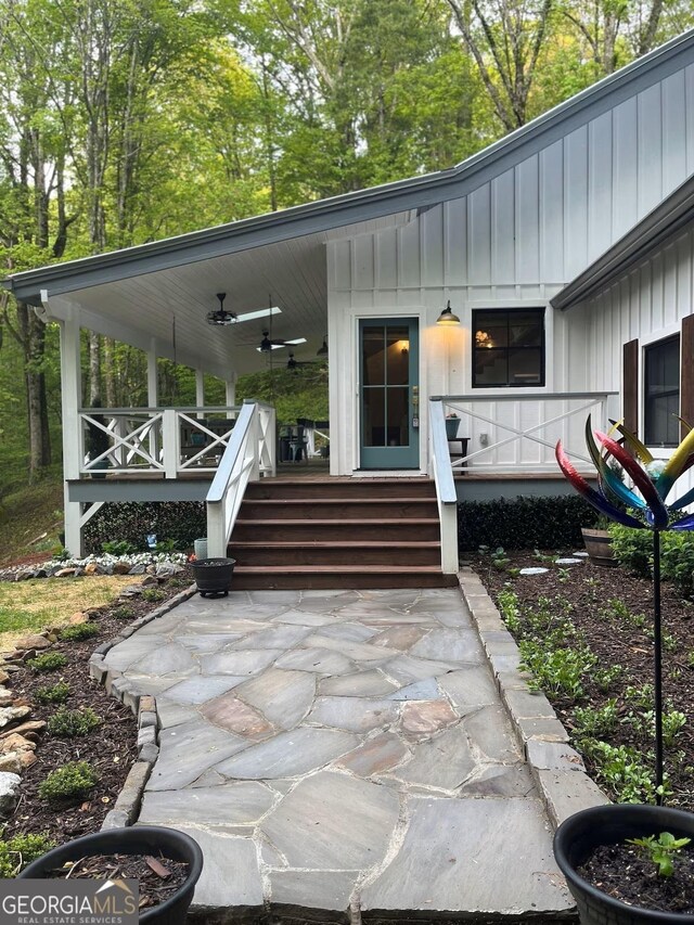 view of patio with ceiling fan and a porch