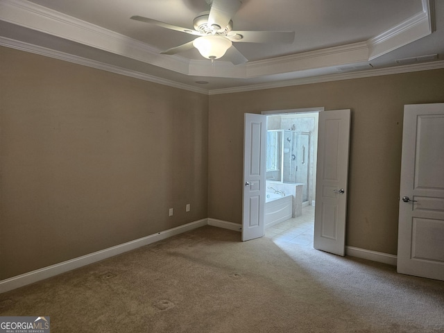 5911 Chimney Rock Dr, Hoschton, GA 30548 - unfurnished bedroom featuring crown molding, light colored carpet, baseboards, a tray ceiling, and visible vents
