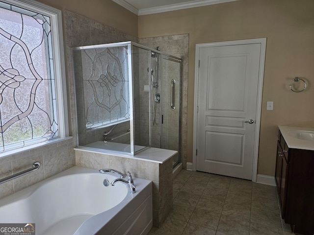 bathroom with tile patterned flooring, ornamental molding, shower with separate bathtub, and vanity