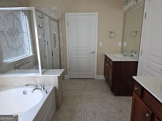 bathroom with vanity, plus walk in shower, and tile patterned flooring