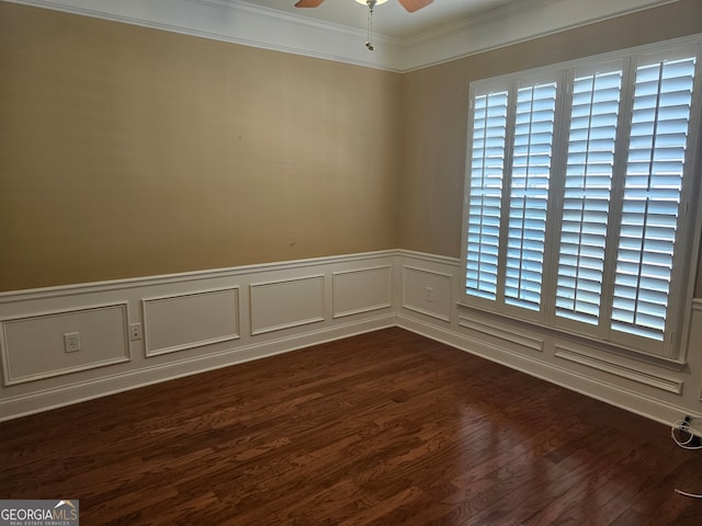 unfurnished room with dark wood-type flooring, crown molding, a wealth of natural light, and ceiling fan