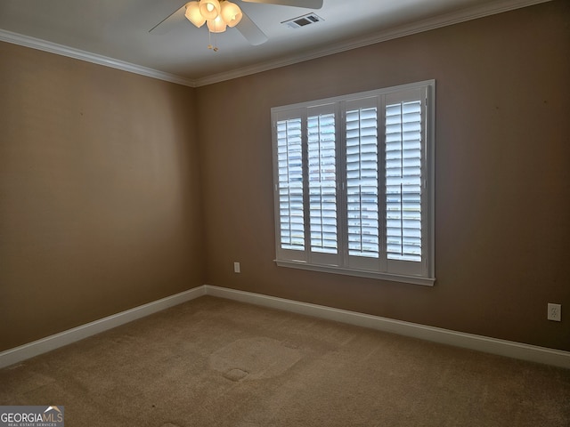 carpeted empty room with crown molding and ceiling fan