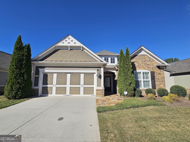 5911 Chimney Rock Dr, Hoschton, GA 30548 - craftsman-style home with an attached garage, a front yard, stone siding, and concrete driveway