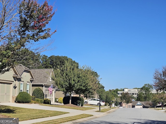 5911 Chimney Rock Dr, Hoschton, GA 30548 - view of road with curbs, sidewalks, and a residential view