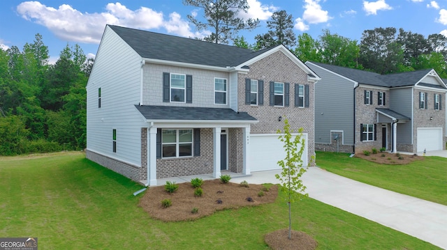 view of front facade with a front yard and a garage