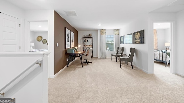 living area featuring light colored carpet