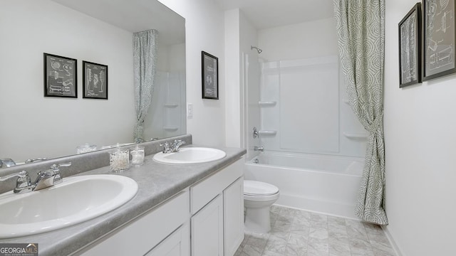 full bathroom with shower / bath combo, vanity, and toilet