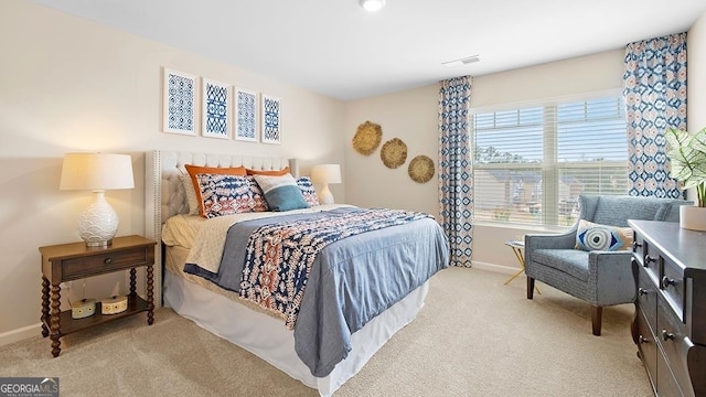 bedroom featuring light colored carpet