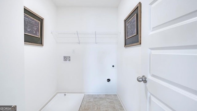 clothes washing area with washer hookup and electric dryer hookup