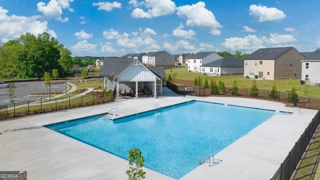 view of swimming pool with a patio area