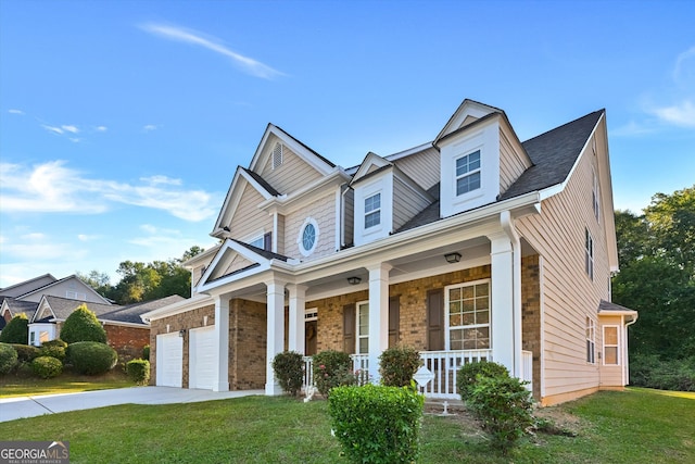 view of front of property with covered porch and a front lawn