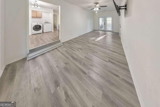 83 Sunset Ln, Newnan, GA 30263 - unfurnished living room featuring baseboards, light wood finished floors, and separate washer and dryer