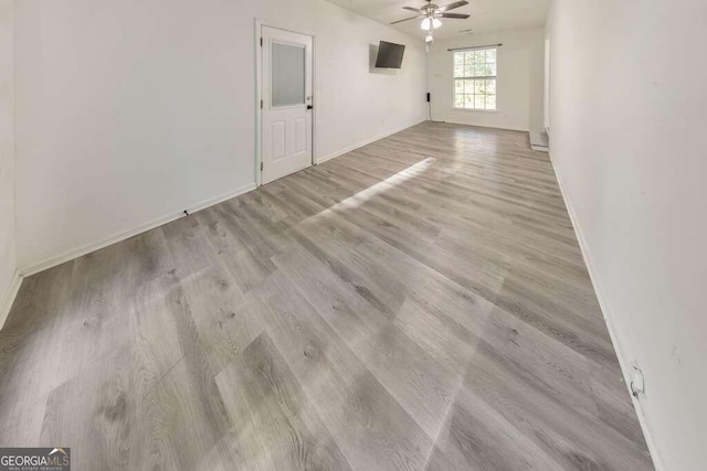 83 Sunset Ln, Newnan, GA 30263 - spare room with wood finished floors, ceiling fan, and baseboards